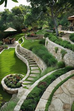 an outdoor garden with stone steps and green grass