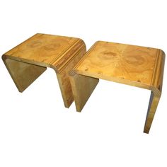 two wooden tables sitting side by side on top of each other in the middle of a white background