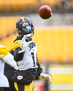 a football player throwing a ball in the air