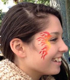 Flames Face Paint, Fire Face Painting, Flame Face Paint, Fire Makeup Halloween, Fire Face Paint, Flame Eye Makeup, Flame Makeup, Voodoo Makeup, Dragon Face Painting