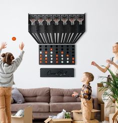 two children playing with an orange ball in a living room