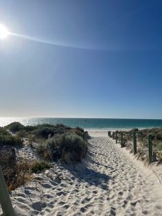 the path to the beach is lined with sand