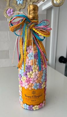 a bottle filled with candy sitting on top of a counter