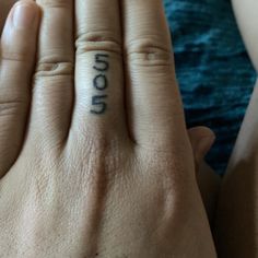 a person's hand with the word hope tattooed on it