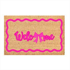 a welcome mat with the word welcome on it and a pink bow in the center