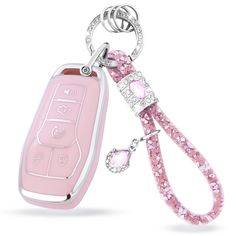 a pink key chain with a remote control attached to it