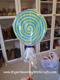 a lollipop is wrapped in plastic and ready to be used as a decoration