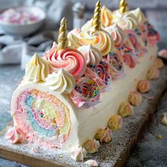 there is a cake that has been decorated with icing and sprinkles