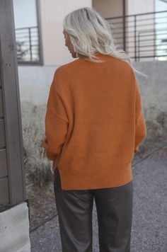 Our oversized knit sweater offers a cozy, relaxed fit with burnt orange rust. Perfect for pairing with your go-to jeans or leggings, this timeless piece will effortlessly carry you through the fall season. relaxed fit oversized design high quality durable knit fabric 9% polyester 36% acrylic 55% cotton model is wearing a medium Trendy Orange Sweater For Layering, Brown Fall Sweater With Ribbed Cuffs, Orange Winter Sweater With Ribbed Cuffs, Oversized Brown Sweater For Layering, Everyday Brown Sweater With Ribbed Cuffs, Brown Sweater With Ribbed Cuffs For Everyday, Oversized Brown Sweater With Ribbed Cuffs, Oversized Brown Turtleneck Sweater, Oversized Brown Knit Sweater