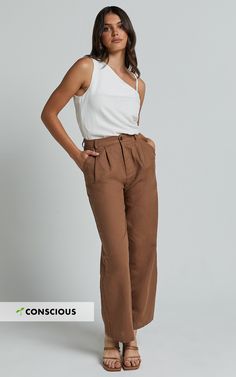 Get ready to elevate your workwear game with our Celenia Pants in Brown. These high-waisted, wide-leg pants are the perfect combination of comfort and style, making them a must-have addition to your wardrobe. Made from premium linen fabric, these pants are not only breathable but also incredibly soft against the skin. The relaxed fit allows for ease of movement, while the full length adds a touch of sophistication. Whether you're heading into the office or stepping out for a brunch date, our Cel High Waisted Wide Leg Pants, Relax Pants, Brunch Date, Stepping Out, Pant Style, Linen Pants, Effortlessly Chic, Body Measurements, Fashion Pants