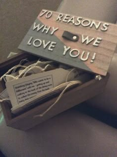 a wooden box with some kind of message inside it that says to reason why we love you