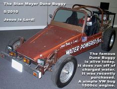 an old style car with the words water power buggy on it's side