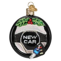 a black and white ornament that says new car with a christmas tree on it