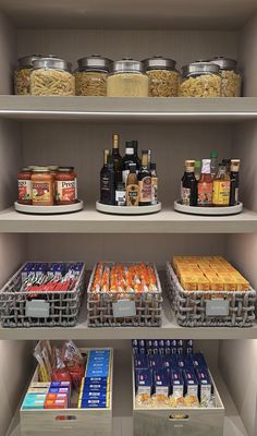 the shelves are filled with various foods and condiments