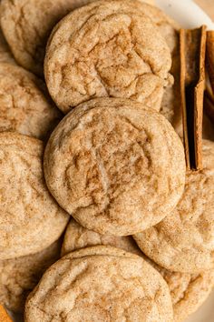 cinnamon spiced cookies on a plate with cinnamon sticks