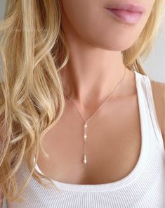 With a dainty and feminine flair, this necklace exudes a subtle sparkle and modern minimalist style ~ Available in 14k gold fill, rose gold fill or sterling silver These genuine freshwater pearls have a gorgeous luster and are nearly flawless! Sparkling crystals are genuine Swarovski Chain can be made in 14k gold filled, sterling silver or rose gold filled Necklace closes with a spring clasp Necklace is shown at 17" length - The length measurement does not include the dangle section The pearl da Rose Gold Choker Necklace, Rose Gold Choker, Pearl Lariat, Pearl Drop Necklace, Choker Pendant, Y Necklace, Choker Necklace Set, Gold Choker Necklace, Gold Choker