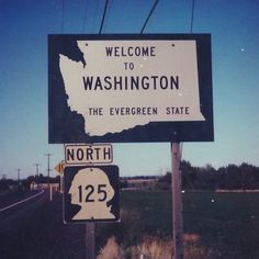 a welcome sign to washington and the evergreen state