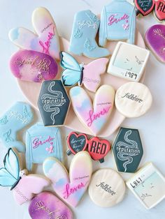 some cookies are decorated with different colors and designs on them for valentine's day