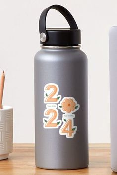 the number twenty four stickers are on this water bottle