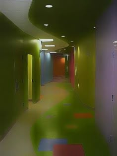 an empty hallway with colorful walls and floors