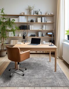 a desk with a laptop on it in front of a bookshelf