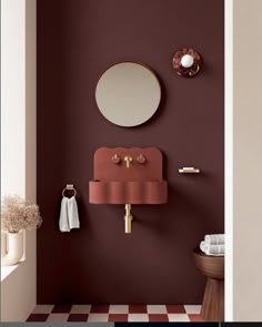 a bathroom with a sink, mirror and towel rack on the wall next to it