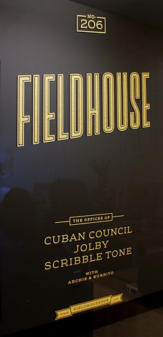 there is a sign that says fieldhouse on the side of the wall in front of it