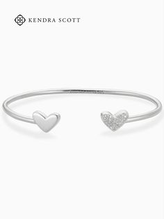 A sparkling iteration of the world's most iconic symbol, the Ari Heart Sterling Silver Cuff Bracelet in White Diamond brings a timeless and elevated touch to your wrist. Sterling Silver Cuff Bracelet For Anniversary, White Gold Cuff Bracelet As Gift, White Gold Cuff Bracelet Fine Jewelry, White Gold Fine Jewelry Cuff Bracelet, Gift Diamond Cuff Bracelet With Polished Finish, Adjustable Cuff Bracelet For Anniversary, Fine Jewelry Style, Adjustable Cuff Bracelet For Anniversary In Fine Jewelry Style, Diamond Cuff Bracelet With Polished Finish As Gift, Adjustable Fine Jewelry Cuff Bracelet For Anniversary