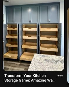 a kitchen with gray cabinets and white counter tops