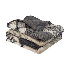 four folded blankets stacked on top of each other in different colors and patterns, with black and white designs