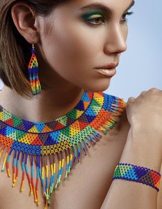 a woman wearing colorful necklaces and earrings