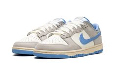 The Nike Dunk Low "Athletic Department" is a colorway of the classic basketball and lifestyle shoe with a vintage look.  From a greater collection of “Athletic Department” colorways by Nike, the Dunk Low seen here features a Sail leather base with light grey synthetic nubuck overlays on the toe, forefoot, eyelets, and heel.  A University Blue leather Swoosh appears on the sides.  Classic “Nike” branding is seen on the heel and on the tongue tag.  An “Athletic Department” logo appears on the inso Sneaker Displays, Sneakers Box, Kobe Shoes, Nike Branding, Ugg Classic Mini, Iron Ore, Exclusive Sneakers, Sneaker Release, Nike Dunk High