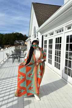 Rich Auntie at it's finest! Our fashion winter long hooded kimono is a fun, colorful and flowy kimono. Open front styling , bold print and hood makes this a statement piece you will want in your closet. One Size fits up to 4X as the sleeves are open flowy and the poncho has an open front. Styling tip: Can be worn over jeans, boots, dresses, or on it's own! Easy transition piece for a coat! Styling options are endless! Fabric composition is tencil wool polyester blend for a flowy fit. Fabric is n Long Multicolor Outerwear For Vacation, Multicolor Long Outerwear For Vacation, Multicolor Long Kimono For Winter, Multicolor Oversized Shawl Outerwear, Hooded Kimono, Coat Styling, Boots Dresses, Rich Auntie, Open Front Poncho