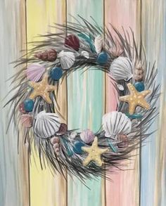 a wreath with seashells and starfish on it