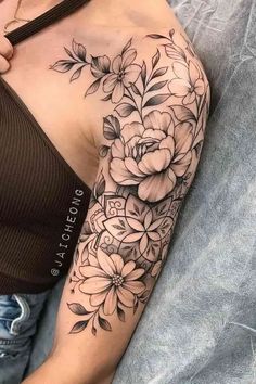 a woman with a flower tattoo on her arm