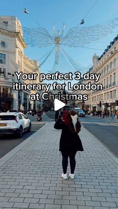 a woman is walking down the street with an umbrella in her hand and text reads, your perfect 3 day itinerary for london at christmas