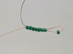 a string with beads attached to it in the air