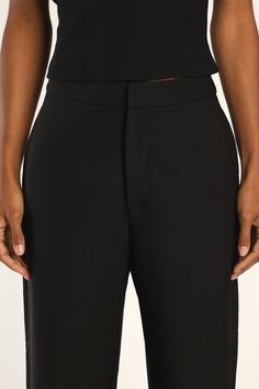 The Lulus Flair for the Fabulous Black Feather Straight Leg Pants are a fun twist on the classic dress pant silhouette! These lightweight woven pants boast a banded waist with a high-rise fit and a hidden top clasp with a hidden zip fly. Side seam pockets accent figure-skimming, straight pant legs before falling to feather-trimmed hems. Pair with the matching top for a complete look! Fit: This garment fits true to size. Length: Ankle length. Size medium Inseam: 27.75 Front Rise: 10.75 Waist: Fit Sleek Wide-leg Pants For Spring, Chic Formal Dress Pants With Elastic Waistband, Elegant Tapered Leg Bottoms With Elastic Waistband, Classic Wide-leg Pants For Party, Chic Dress Pants With Elastic Waistband, Sleek Straight Dress Pants For Spring, Modern Black Pants For Party, Sleek Evening Dress Pants For Spring, Modern Black Party Pants