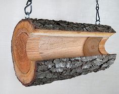 a piece of wood that is hanging from chains