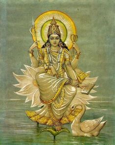 the hindu goddess sitting on top of a swan