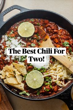 the best chili for two in a skillet with tortilla chips and limes