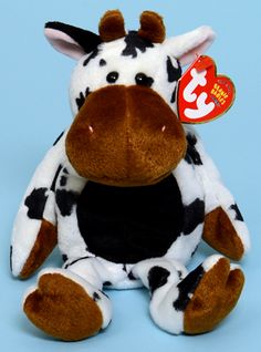 a brown and white cow sitting on top of a blue background with a tag in it's ear