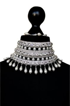 Bridal embroidered necklace in silver tones with white pearls and crystal beads for bride. This necklace can decorate any neck. It can be dressed for a wedding, engagement or for a holiday or New Year's party There are 3  clasps at the back for a secure fit. The length of the chocker is adjustable.  Only high-quality materials were used in the creation of this gorgeous necklace Earrings I put as a gift) length - 31.5 cm (12.2 inch) width - 9 cm (3.4 inch) weight - 135 gram In this necklace you will be absolutely incomparable and unique. You will get a lot of compliments and enthusiastic looks from others  Buying a necklace a pleasant gift awaits you You might also like https://www.etsy.com/shop/AliceCrownStore?ref=seller-platform-mcnav&section_id=35435354 If you have any questions please c White Crystal Bridal Sets For Party, Glamorous White Jewelry For Reception, Silver Bridal Sets With Rhinestones For Party, White Bridal Pearl Choker Necklace, Glamorous White Beaded Pearl Necklace, Elegant White Choker For Reception, Pearl Choker Bridal Necklace For Wedding, Silver Pearl Necklace With Rhinestones For Wedding, Party Pearl Necklace With Stone Work