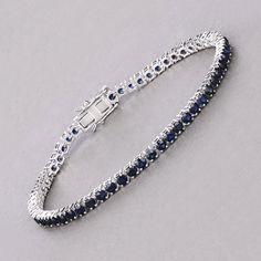 14k Gold Blue Sapphire Bracelet, Genuine Blue Sapphire Rounds Gold Bracelet for Women, Blue Sapphire Gold Tennis Bracelet, Gift for Her Dazzle in the deep blue allure of this 14K white gold tennis bracelet, featuring 6.38 carats of genuine round blue sapphires. Each sapphire is meticulously set to create a seamless line of vibrant color, perfect for adding a touch of luxury to any ensemble. The bracelet's classic design is enhanced by its secure box clasp, ensuring both elegance and peace of min Luxury Sapphire Jubilee Bracelet, White Gold Sapphire Jubilee Bracelet, White Gold Sapphire Bracelet In Fine Jewelry Style, Luxury Blue Diamond Bracelet For Formal Occasions, Luxury Blue Diamond Bracelet For Formal Events, White Gold Sapphire Tennis Bracelet, Luxury Blue Diamond Bracelet For Anniversary, Sapphire Bracelets For Formal Occasions, Formal Sapphire Round Bracelets