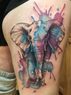 an elephant with watercolor splashs on it's back leg is seen in this image