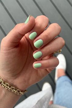 Capture the essence of spring with these short, rounded nails, painted in a soothing pastel mint green. Each nail is uniformly colored, creating a soft and clean look that's perfect for any casual or elegant occasion. Refreshing and chic! 🌿✨  // Photo Credit: Instagram @vino_and_varnish Short Almond Nails Pastel Colors, Pastel Solid Nails, Chic Summer Nails 2024, Mint Green Manicure, Light Green Gel Nails Short, Short Gel Nails Summer Pastel, Pastel Green Gel Nails, Pastel Lime Green Nails, Short Summer Nails Green