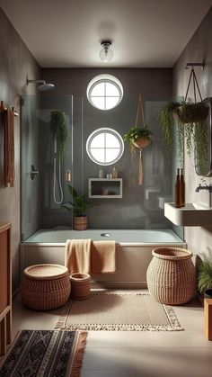 a bathroom with a bathtub, sink and rugs on the floor in front of it