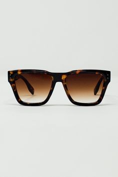 Step up your summer style with our Square Chunky Sunglasses in Tortoise Shell with Degrade Lenses. These sunglasses feature a bold square shape and a chunky fit, providing a fashionable and eye-catching accessory that complements any outfit. The tortoise shell frame adds a touch of classic elegance, while the degrade lenses offer a modern twist, ensuring you look chic and sophisticated in the sun.  Crafted from 100% polycarbonate, these sunglasses are both durable and lightweight, perfect for all-day comfort. The model is wearing size U, a universal fit that suits various face shapes and sizes. Whether you're lounging by the pool or out for a city stroll, these sunglasses are the ideal accessory to elevate your summer ensemble. Chunky Sunglasses, Square Form, Shell Frame, Photography Gifts, Scarf Headband, Romper Pants, Swimsuit Cover, Square Shape