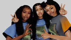 three young women posing for the camera with their fingers in the shape of peace signs