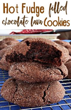 chocolate cookies stacked on top of each other on a cooling rack next to another cookie